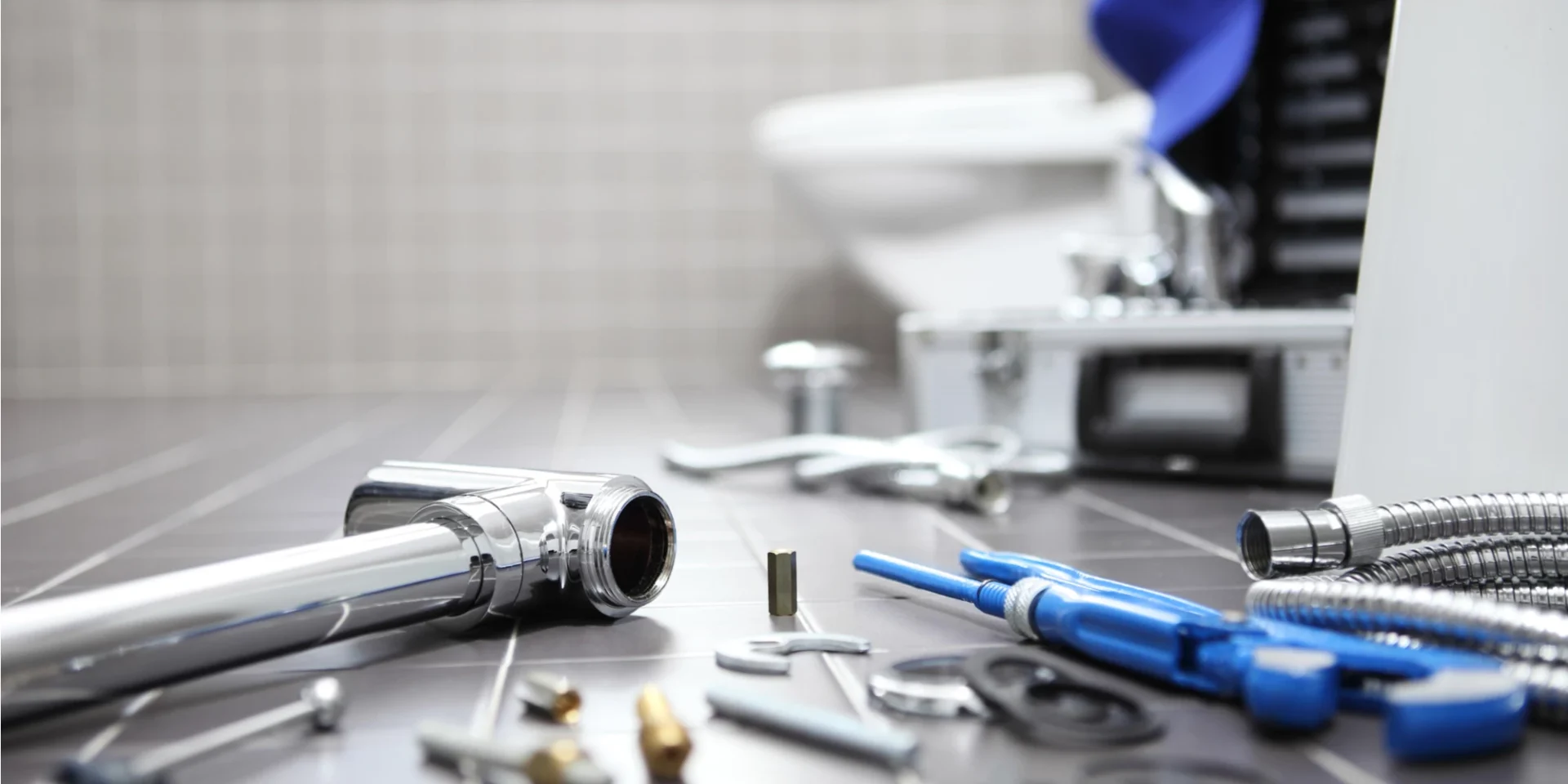 shutterstock_1024475101 a bathroom counter with various tools and equipment scattered around